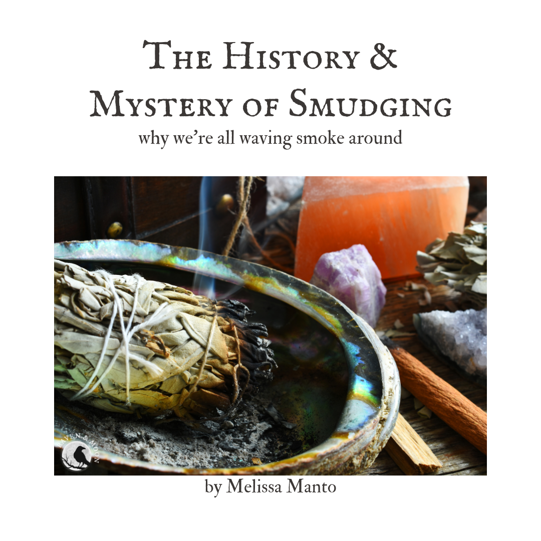 White Sage smudge bundle is smoking in an abalone shell. There are ...
